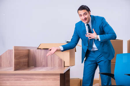 Young handsome businessman being fired from his workの写真素材