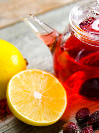 Fruit berry tea in the cup served on tableの写真素材
