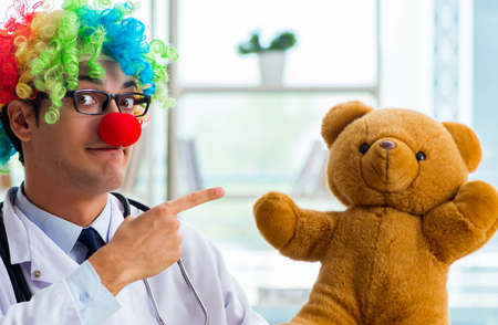 Funny pediatrician with toy in the hospital clinicの写真素材