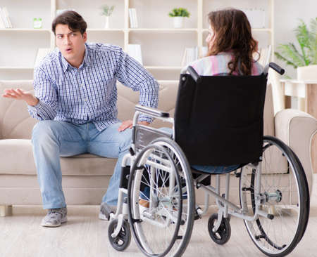 Desperate disabled person on wheelchairの写真素材