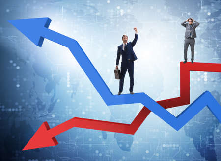 Businessman with charts of growth and decline