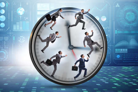 Man and woman running on clockの写真素材