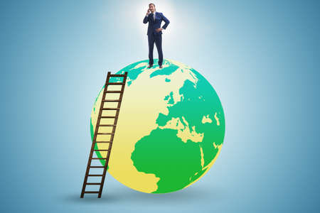 Businessman on top of the worldの写真素材