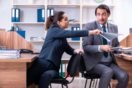 Two employees working in the officeの写真素材