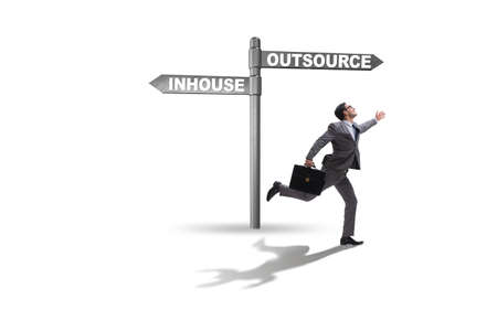 Businessman deciding between outsourcing and inhouseの写真素材