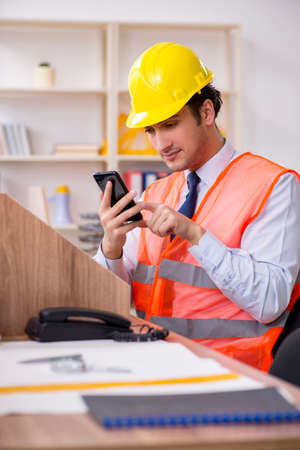 Young male architect working in the officeの写真素材