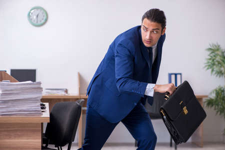 Young handsome businessman working in the officeの写真素材