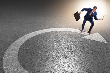 Businessman riding skateboard on financial graphの写真素材