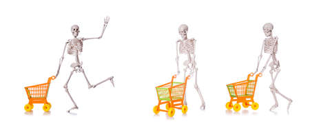 The skeleton with shopping cart trolley isolated on whiteの写真素材