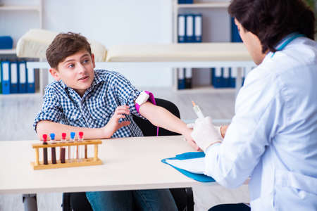 Boy in blood tranfusion conceptの写真素材