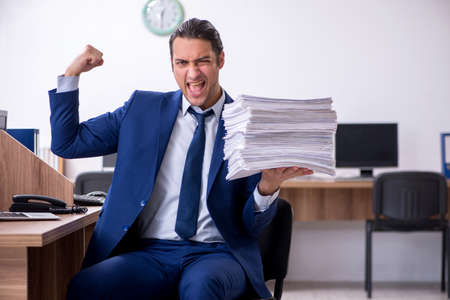 Young handsome businessman working in the officeの写真素材