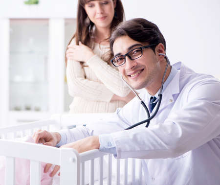 Doctor explaining to young motherの写真素材