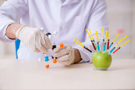 The male nutrition expert testing food products in labの写真素材