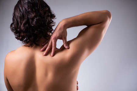 Young man suffering from upper limb pain
