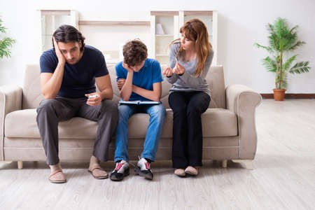 Concept of underage smoking with young boy and familyの写真素材