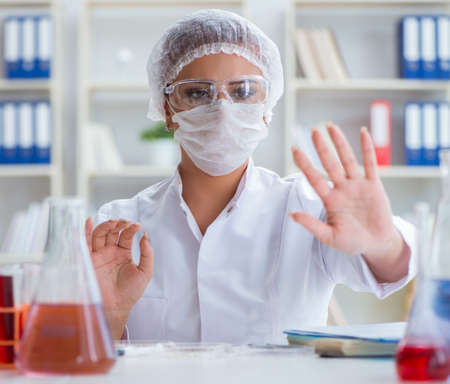 Female scientist researcher conducting an experiment in a laboraの写真素材