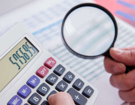 Finance analyst looking and financial reportsの写真素材