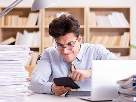 Funny accountant bookkeeper working in the officeの写真素材