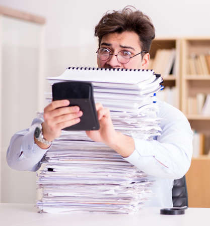 Funny accountant bookkeeper working in the officeの写真素材