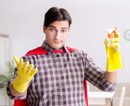 The super hero cleaner doing houseworkの写真素材