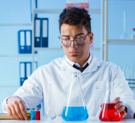 Funny mad chemist working in a laboratory