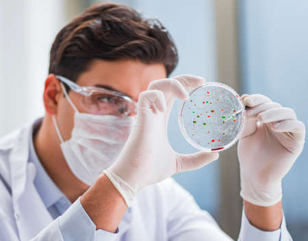 Male doctor working in the lab on virus vaccineの写真素材