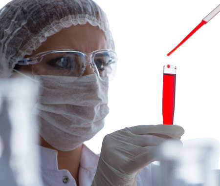 Female scientist researcher conducting an experiment in a laboraの写真素材