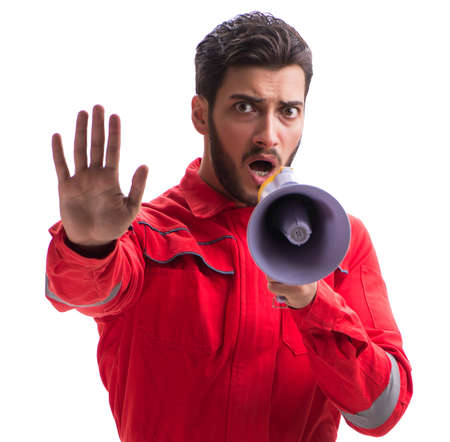 Young repairman with a megaphone bullhorn isolated on white backの写真素材