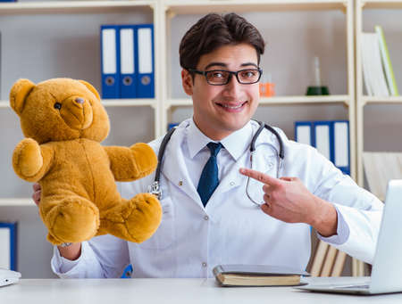 Doctor veterinary pediatrician holding an examination in the offの写真素材