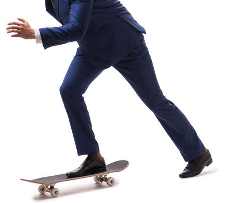 The businessman riding skateboard isolated on white backgroundの写真素材