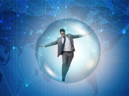 Businessman flying inside the bubbleの写真素材