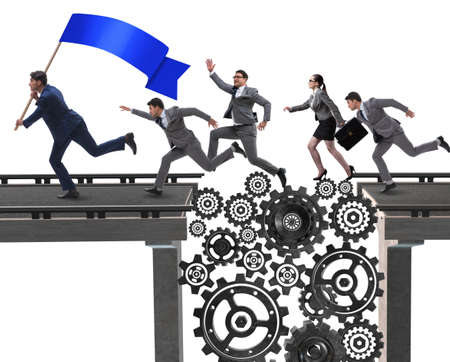 Business people crossing the bridge with cogwheelsの写真素材