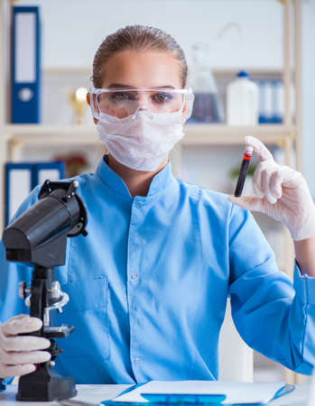 Female scientist researcher conducting an experiment in a labの写真素材