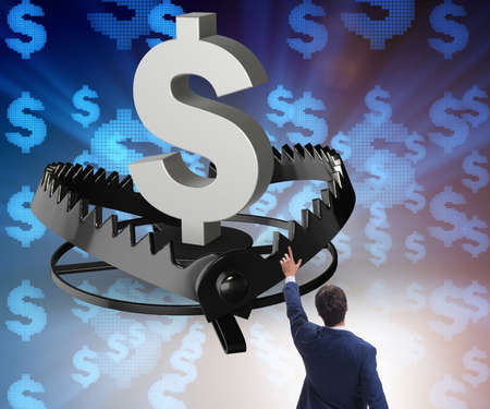 Businessman being trapped by dollarの写真素材