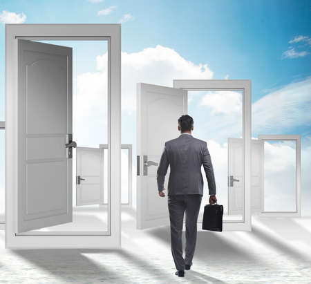 Businessman facing many business opportunitiesの写真素材