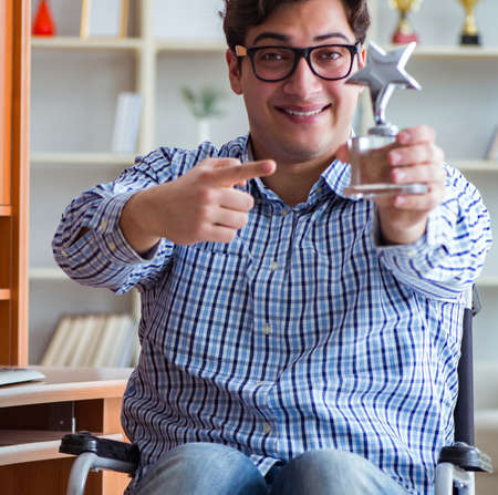 Disabled student studying at home on wheelchairの写真素材