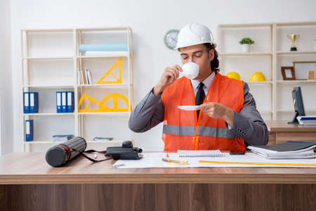 Young male architect working in the officeの写真素材