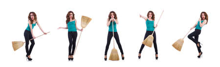 Young woman with broom isolated on whiteの写真素材