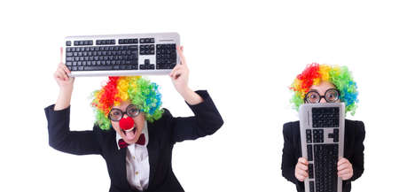 Funny clown with keyboard on whiteの写真素材