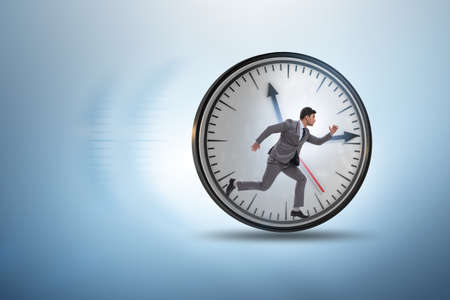 Businessman employee in time management conceptの写真素材
