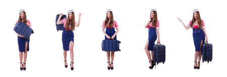 Woman travel attendant with suitcase on whiteの写真素材