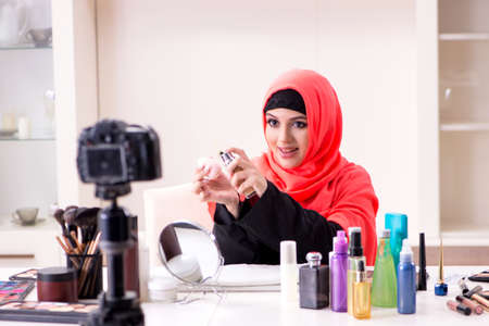 Beauty blogger in hijab recording video for her blogの写真素材