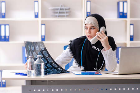 Young doctor in hijab working in the clinicの写真素材
