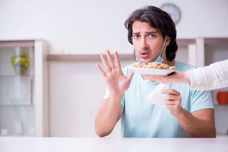 Young man suffering from allergyの写真素材