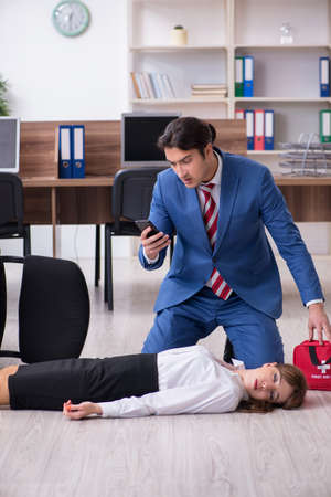 Young employee suffering in the officeの写真素材