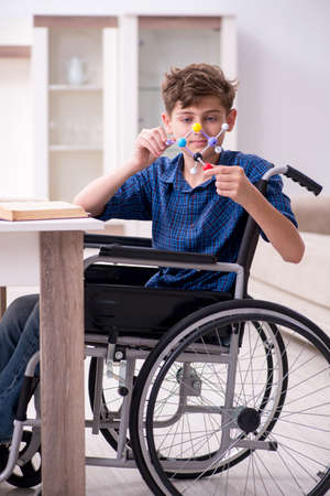 Disabled kid preparing for school at homeの写真素材
