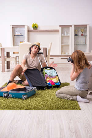 Young couple preparing for tripの写真素材