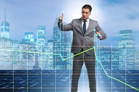 Businessman controlling the market with strings