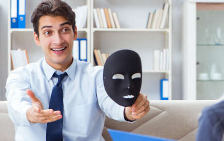 Young man visiting psychiatrist doctor for consultationの写真素材