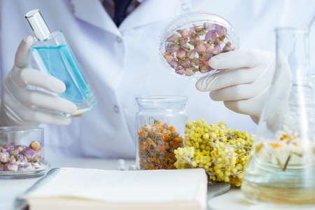 Chemist mixing perfumes in the lab